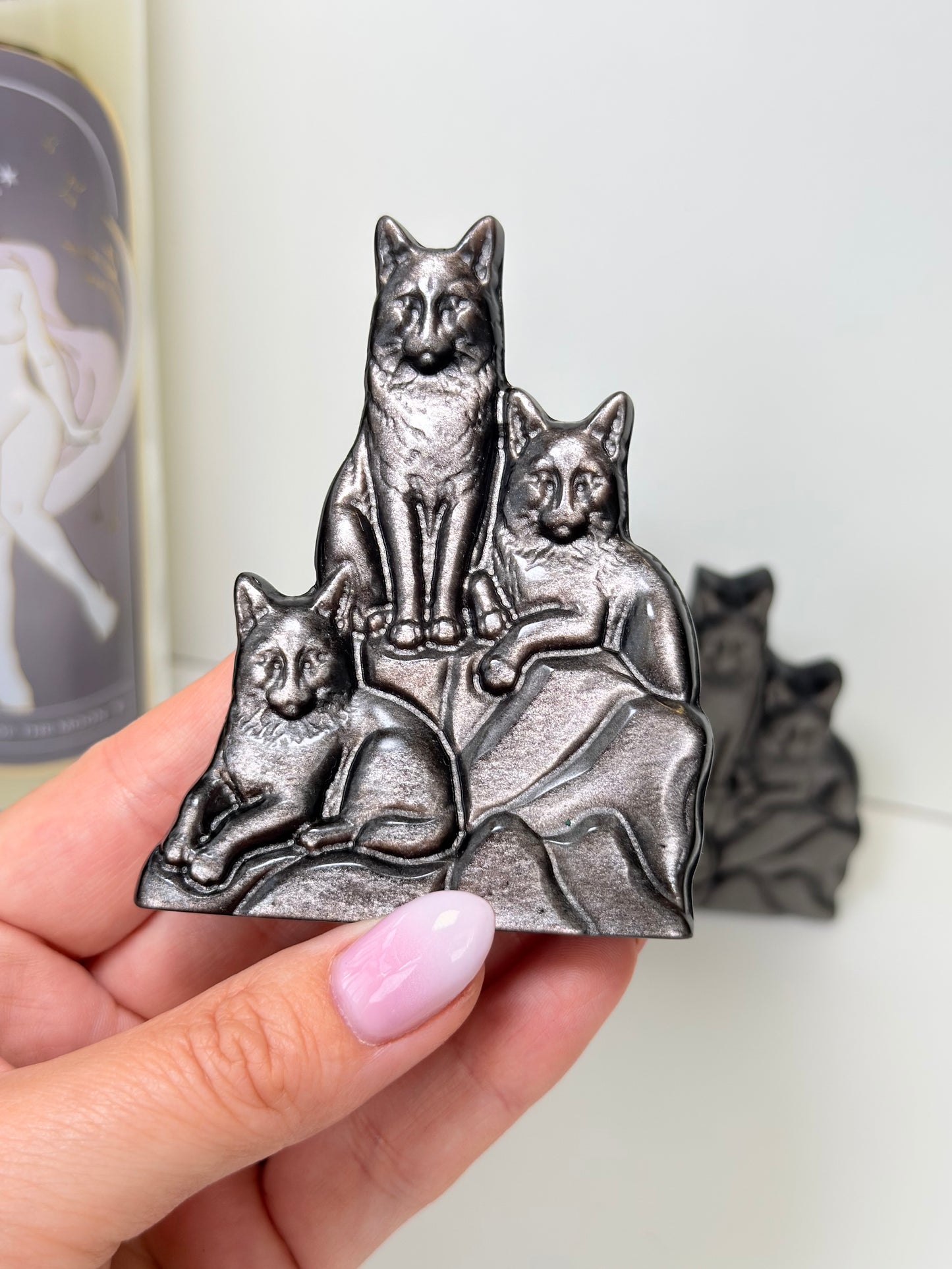 Silver Sheen Obsidian Wolves Carving